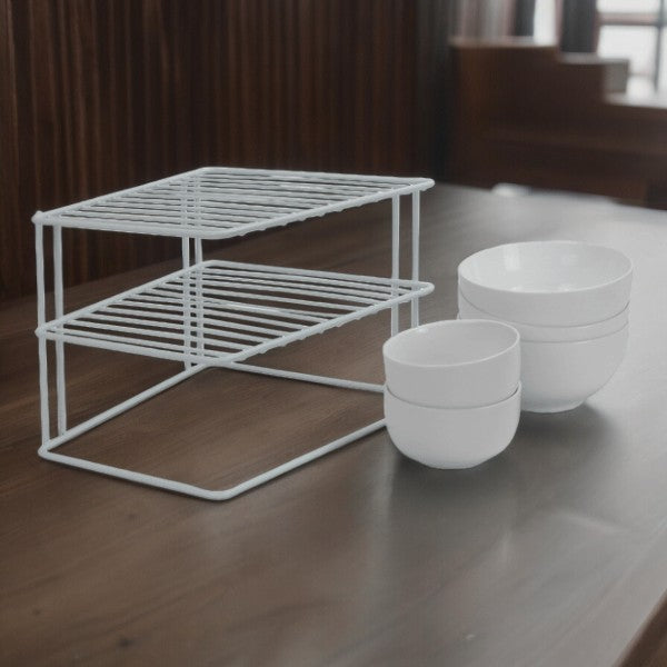 White kitchen shelf organiser on a worktop beside bowls
