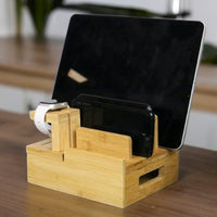 Bamboo device organiser holding a tablet, phone and watch
