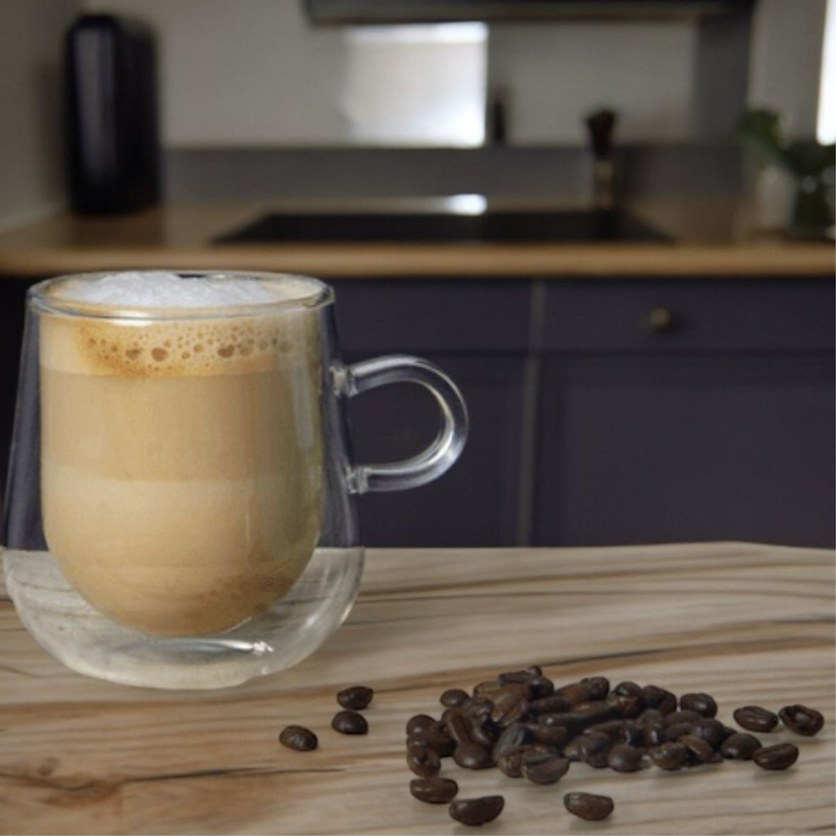 275ml double-walled glass mug holding coffee on a wooden counter