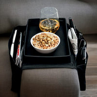 Front view of black six-pocket sofa organiser draped over an armrest