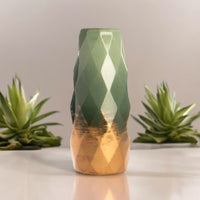 Empty green geometric vase with gold-tone lower section