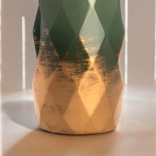 Close-up of the vase’s geometric facets and gold-tone base