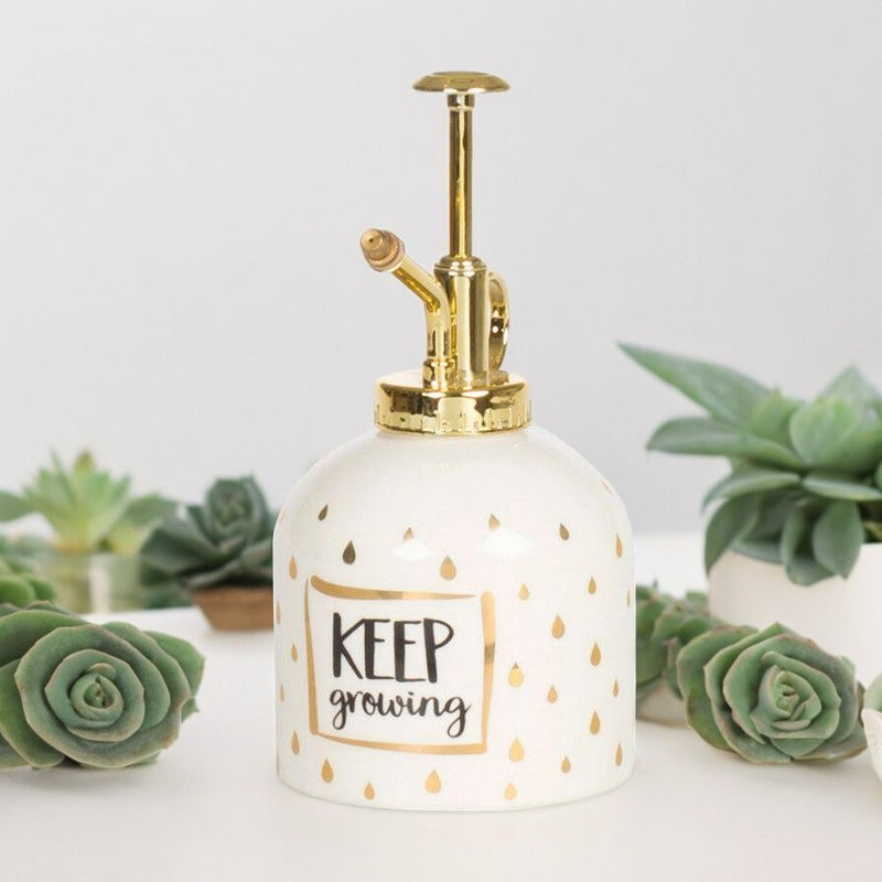 Keep Growing ceramic plant mister with gold pump and droplet pattern