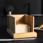 Bamboo Bread Slicer being easily folded for storage, highlighting its convenient and compact design