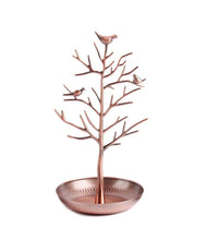 Rose-gold tree jewellery stand with bird-topped branches and round tray