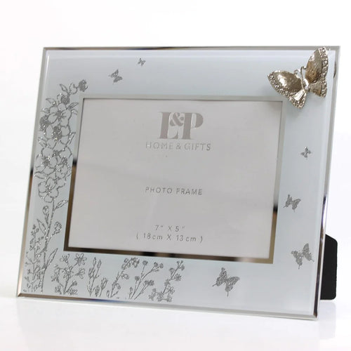 Mirrored Floral With Butterfly Glass Photo Standing Frame - Reflection Detail. The mirrored surface creates a mesmerizing reflection, enhancing the beauty of cherished photographs. Intricate floral design and fluttering butterflies symbolize joy and transformation.