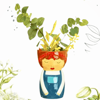 Libby ceramic character vase in blue dungarees holding flowers