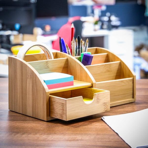 Close-up of the bamboo organiser's open drawer and stationery compartments