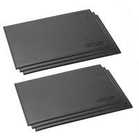 Six rectangular black faux leather placemats
