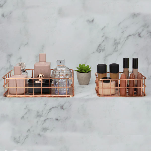 Rectangular rose gold baskets organising cosmetics