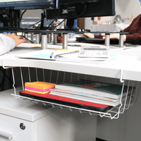 Under-shelf basket holding notebooks and office stationery