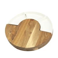 Closed round acacia cheese board with curved white ceramic dishes