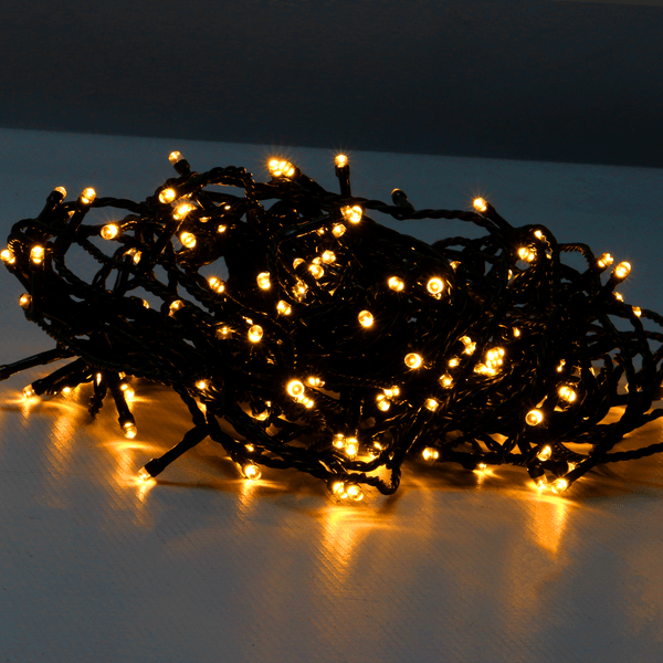 Warm white LED fairy lights glowing in a loose bundle
