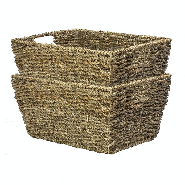Two matching natural seagrass baskets nested together