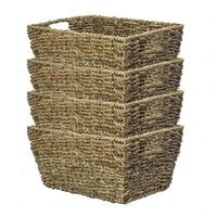 Four natural seagrass storage baskets nested together