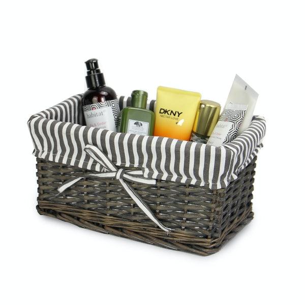 Small grey wicker basket with striped lining and toiletries