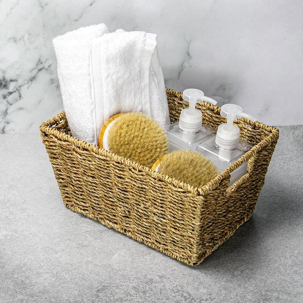 Seagrass basket holding towels and toiletries