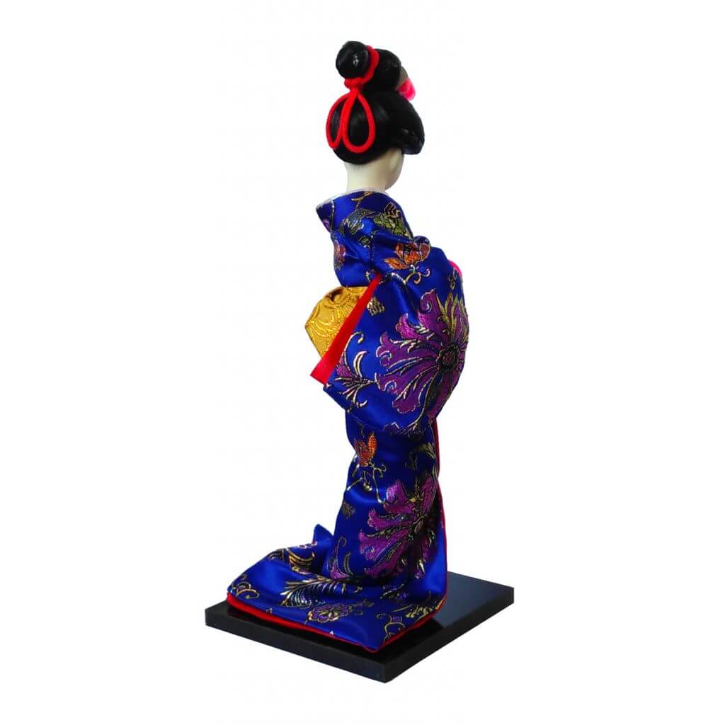 Side view of the blue kimono geisha doll showing her hairstyle and fabric sleeves