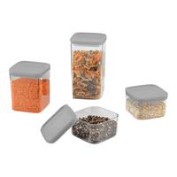 Clear dry food containers showing grey lids and an open container