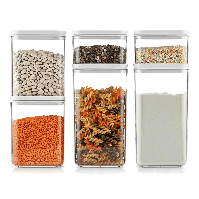 Six clear food storage containers in three sizes filled with dry ingredients