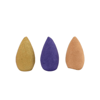 Three upright backflow incense cones in assorted colours