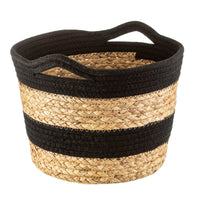 Round seagrass basket with black rope stripes and integrated handles