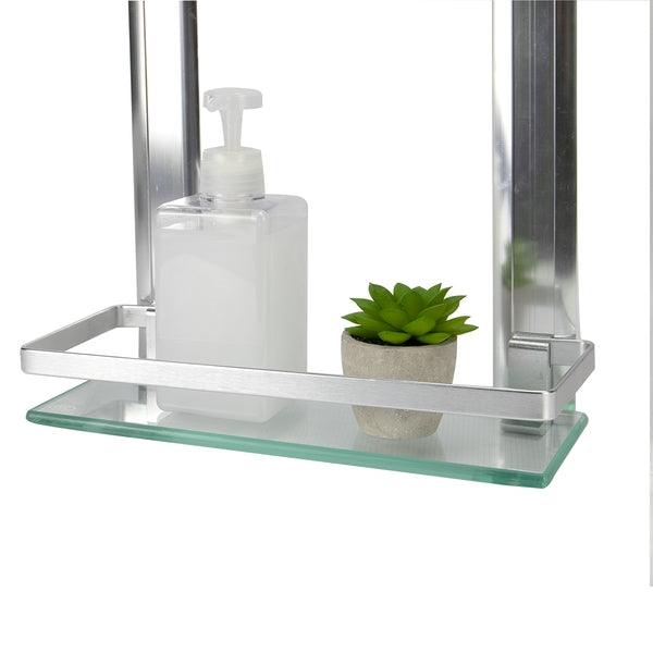 Close-up of the bathroom shelf's lower glass tier and front rail