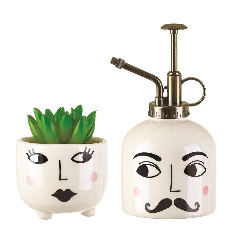 Mister and Mrs white plant mister and face planter styled with a succulent