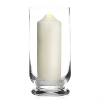 Clear glass hurricane holder shown with a pillar candle