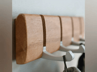 Close-up of the wood grain and silver-coloured folding hooks