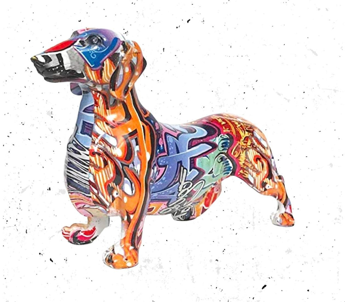 Standing dachshund resin figurine covered in colourful graffiti-style patterns, angled front view