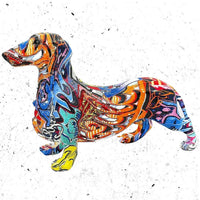 Side view of the colourful graffiti-patterned sausage dog figurine