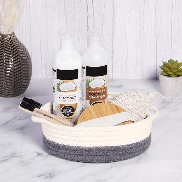 Grey and white basket holding toiletries and brushes