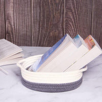 Grey and white rope basket used to organise papers