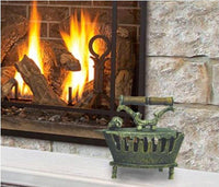 Vintage-style decorative coal iron displayed beside a fireplace