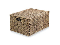 Seagrass storage basket with the lid closed and carry handle visible