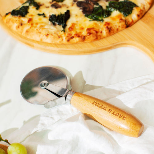 Bamboo Pizza Cutter cutting through a fresh, hot pizza with ease, delivering perfectly sliced pieces