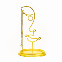 Leila face jewellery holder displaying jewellery above a round base dish