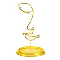 Leila gold wire jewellery stand shaped as an abstract face