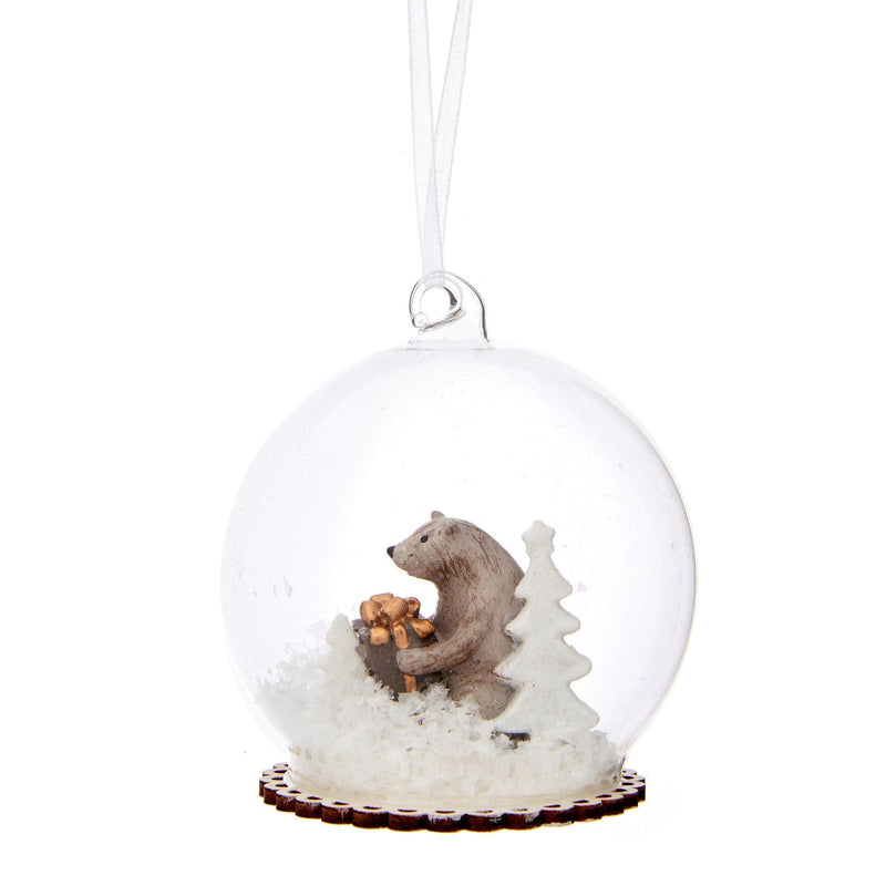 Clear glass Christmas dome bauble with a miniature bear, snowy tree and white hanging loop
