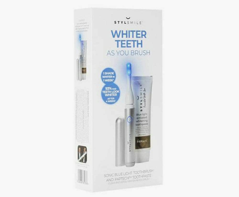Angled view of the STYLSMILE brush-and-toothpaste kit packaging