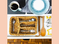 Brown woven typha organiser tray holding cutlery inside a kitchen drawer