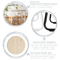 Details of the bar stool's tubular black frame and round pine seat
